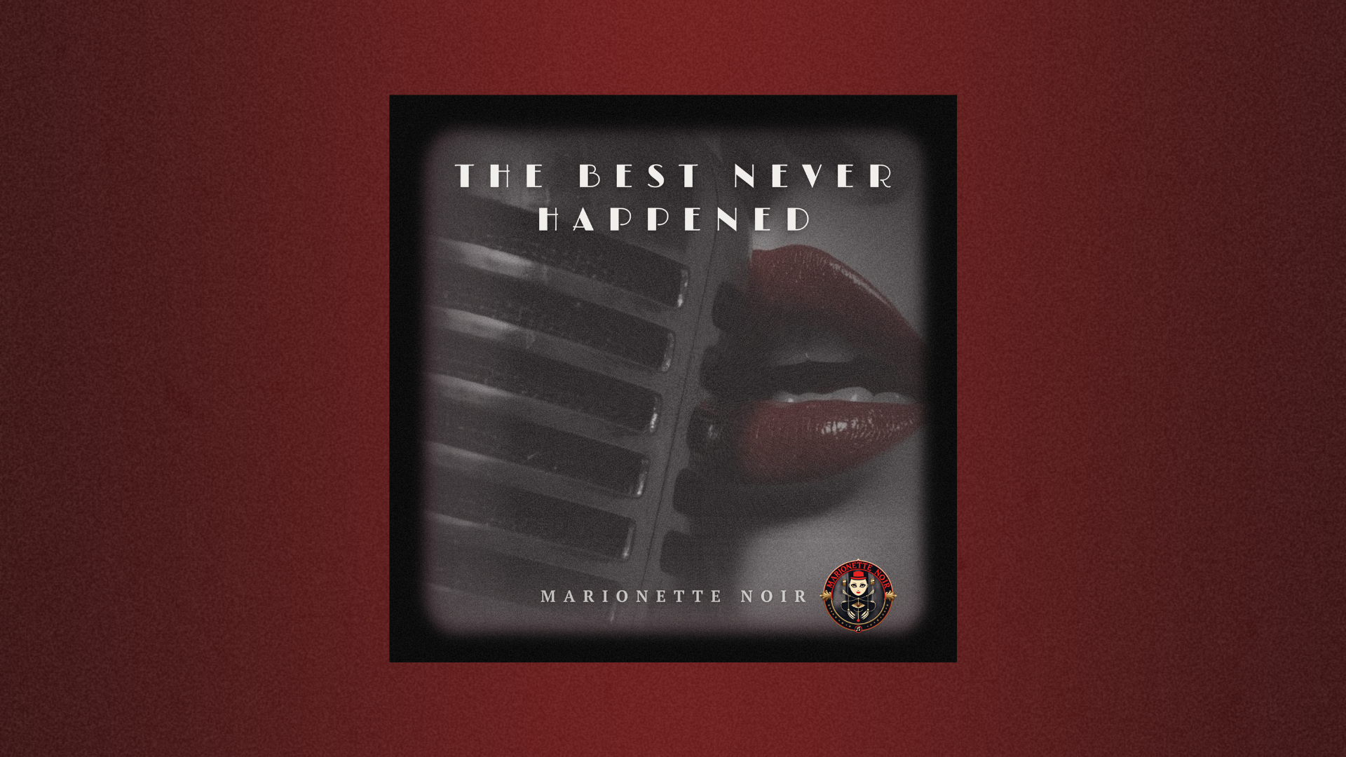 A widescreen Electronic Press Kit header graphic for Marionette Noir. Centered on a deep burgundy textured background is the square cover art for the single "The Best Never Happened," featuring a shadowed vintage microphone and glossy red lips. The track title and artist name are displayed in elegant white typography alongside the Marionette Noir brand logo.